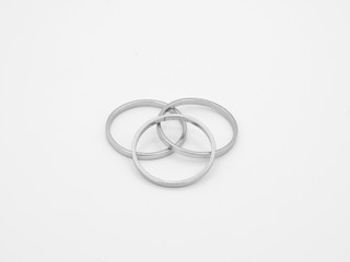 three old silver rings on white background