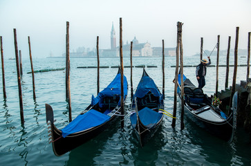 Fototapeta na wymiar Grand Сhannel with gondola and gondolier, Venice, Italy. Beautiful ancient romantic italian city.