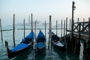 Fototapeta na wymiar Grand Сhannel with gondola and gondolier, Venice, Italy. Beautiful ancient romantic italian city.