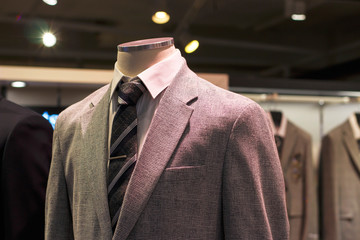 Gray jacket close-up front view, in the men's clothing store.