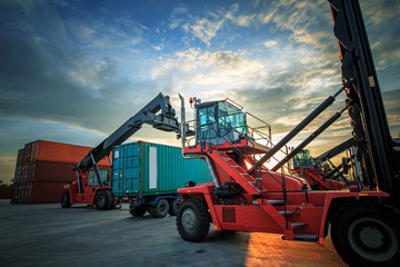 Forklift handling the container box.