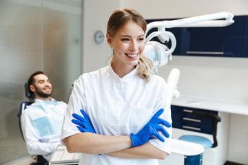 Happy young woman doctor in medical dentist center.