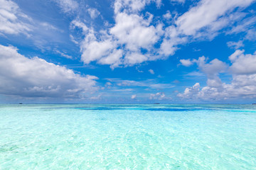 Fototapeta na wymiar Tropical sea view, blue and turquoise water colors with clouds sky. Perfect nature environment, clean energy and calmness concept 
