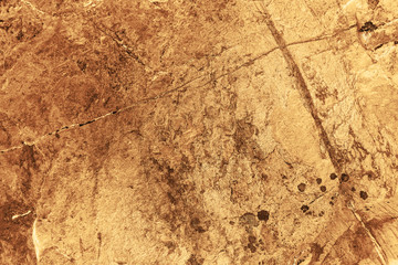 Vintage yellow background. Rough painted wall of aspen gold color. Imperfect plane of golden colored. Uneven old decorative toned backdrop of yellow tint. Texture of gold hue. Ornamental stony surface