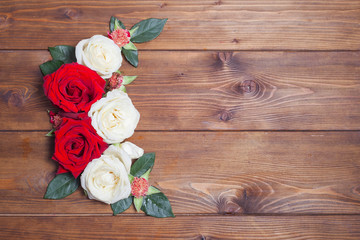 White and red roses decor on wooden background