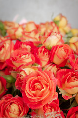 Large beautiful bouquet of orange roses in the package