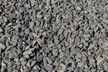 Pattern of gray broken rocks.