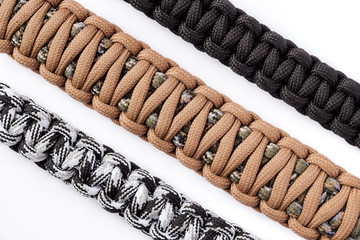 Three paracord bracelets isolated on white bacground.