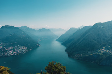 Obraz premium Aerial View on Alps and Lake Lugano on foggy morning. Switzerland.