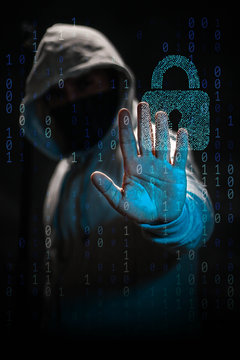 Internet crime concept. Hacker working on a code on dark digital background