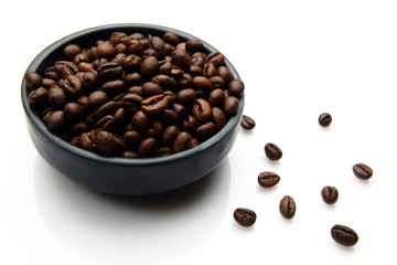 Roasted Coffee beans in a bowl on white background
