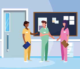 interracial group medicine workers in hospital corridor