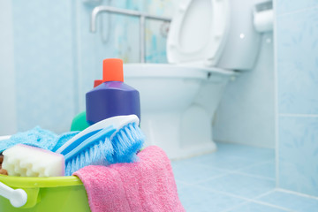 Cleaning with a bucket and cleaning products on blurred background. - Image