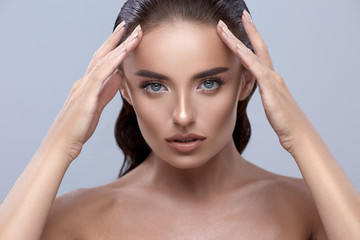 Fototapeta premium woman touching her face, pretty girl close up, brunette model touchs her face, beauty look