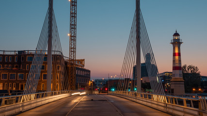 An evening landscape of Malmo - with bridge constructions and a lighthouse