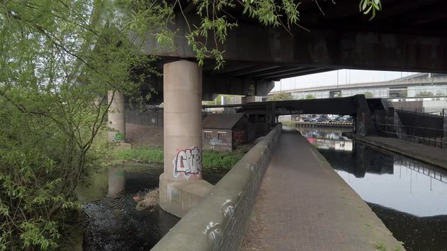 Under Spaghetti Junction.  The river Tame and the Birmingham and Fazeley canal under the roadways of the Gravelly Hill Interchange.