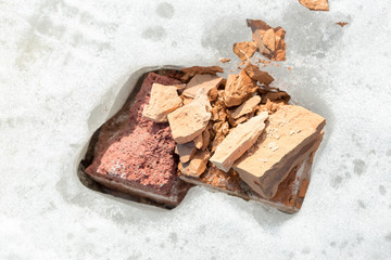 cold winter, broken bricks remain under the snow
