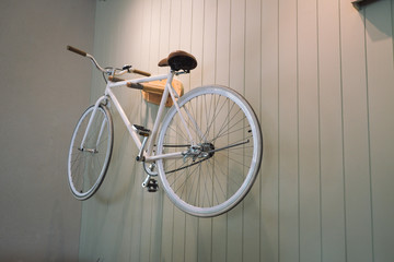 white classic bicycle on wall
