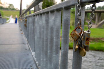 Locks on the metal bridge in Latvia.