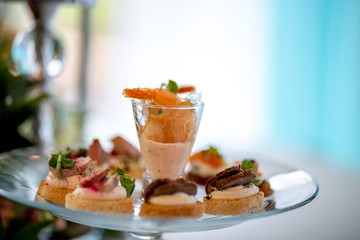 Shrimp salad and sandwiches on plate.