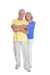 Full length portrait of senior couple embracing isolated