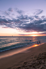 sunset on beach in Waikiki