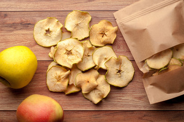 Homemade dried apple chips and fresh apples.Healthy snack. 