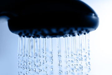 Naklejka na ściany i meble Shower head and water drops.