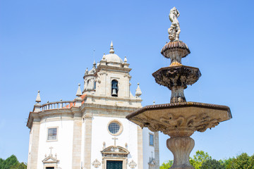 Fountain Largo da Porta Nova and church Bom Jesus da Cruz in background, Barcelos, Portugal