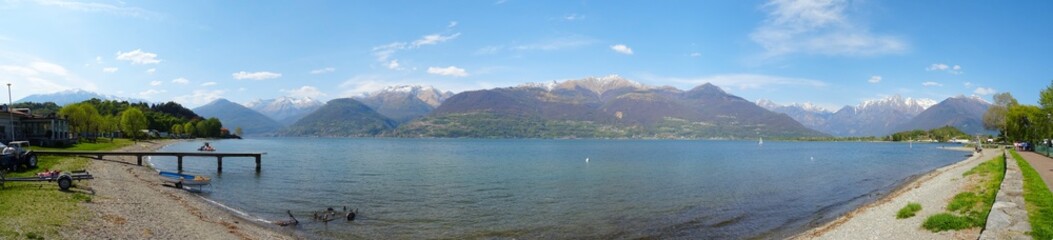 Lake Como, Italy - April 2019: panoramic view of the lake and the Italian Alps in the background.