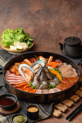 Close up raw seafood, fish, mussels, oyster, mushroom and meat in a set preparing for serve in a restaurant
