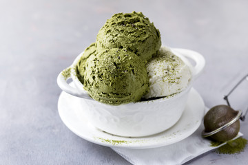 Green Tea Matcha and Coconut Ice Cream in White Bowl on a Grey Background Tasty Healthy Vegan Ice Cream Horizontal