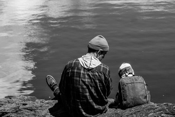 Man and Boy Watching Ocean