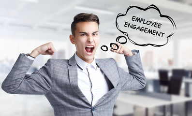 Business, technology, internet and networking concept. Young entrepreneur shouts out a keyword: Employee engagement