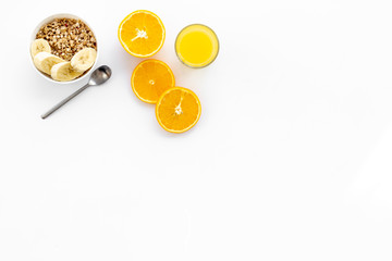 Fototapeta na wymiar Healthy granola and orange juice for colorful breakfast on white background top view mock-up