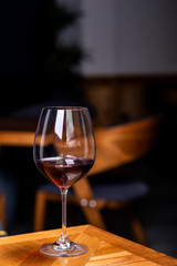 Glass with red wine, tasting, restaurant