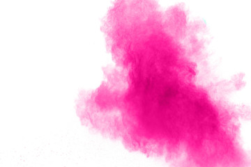 Abstract pink powder explosion on white background. Freeze motion of pink dust splattered.