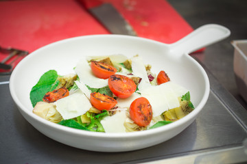 concept of healthy food, Italian vegetable salad with tomatoes and balsamic vinegar