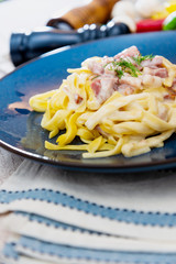 tasty Carbonara pasta on the table