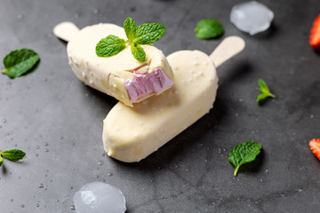 Strawberry Ice cream stick covered with white chocolate
