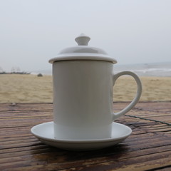Coffee cup with lid to prevent insects from flying into the coffee seen in Vietnam