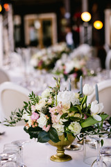 Flower arrangement on the table, wedding in summer