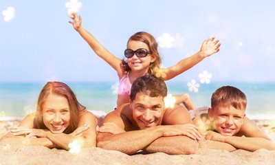 Happy family on vacations on beach background