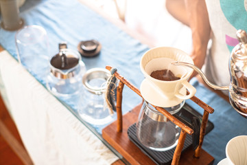 Drip brewing, filtered coffee, or pour-over is a method which involves pouring water over roasted, ground coffee beans contained in a filter , background 