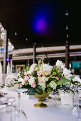 Flower arrangement on the table, wedding in summer