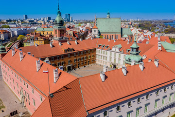 Warsaw, Poland Historic cityscape skyline roof with colorful architecture buildings in old town market square and church tower with blue sky