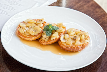 breakfast pastries decorated with mint on the table