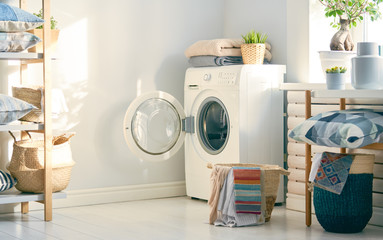 laundry room with a washing machine - obrazy, fototapety, plakaty