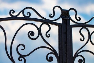 Fototapeta na wymiar beautiful decorative metal elements forged wrought iron gates