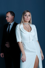 Portrait of a stylish young couple  at wall